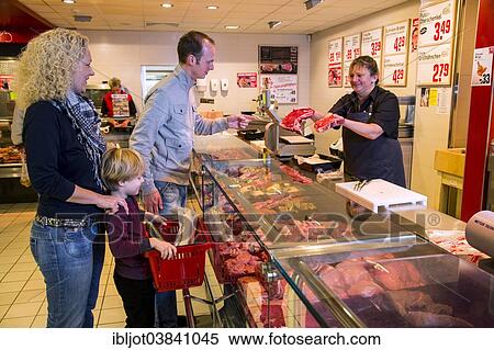 "Family shopping at the meat counter in at supermarket, Germany, Europe" View Large Photo Image Stock Photography - "Family shopping at the meat counter in at supermarket, Germany, Europe". Fotosearch