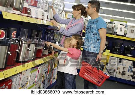 "Family shopping for household appliances, woman, 35, male, 37, girl, 7, boy, 5" View Large Photo Image Stock Image - "Family shopping for household appliances, woman, 35, male, 37, girl, 7, boy, 5". Fotosearch