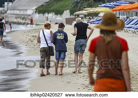 Family, three generations, seeking shells on the beach, Cote d'Azur, France, Europe View Large Photo Image Stock Photo - Family, three generations, seeking shells on the beach, Cote d'Azur, France, Europe. Fotosearch