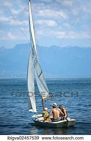 "Family trip on a sail boat on Lake Geneva near Morges, Vaud Alps at back, Alpes vaudoises, Canton of Vaud, Switzerland, Europe" View Large Photo Image Stock Photo - "Family trip on a sail boat on Lake Geneva near Morges, Vaud Alps at back, Alpes vaudoises, Canton of Vaud, Switzerland, Europe". Fotosearch