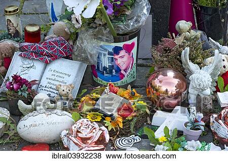 "Fan gifts next to the stele commemorating Elvis Presley in front of his former residence Hotel Grunewald, Bad Nauheim, Hesse, Germany, Europe" View Large Photo Image Stock Photo - "Fan gifts next to the stele commemorating Elvis Presley in front of his former residence Hotel Grunewald, Bad Nauheim, Hesse, Germany, Europe". Fotosearch