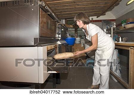 "Farmer making bread in her own bakery at the farm, feeding the oven, Tyrol, Austria, Europe" View Large Photo Image Stock Image - "Farmer making bread in her own bakery at the farm, feeding the oven, Tyrol, Austria, Europe". Fotosearch