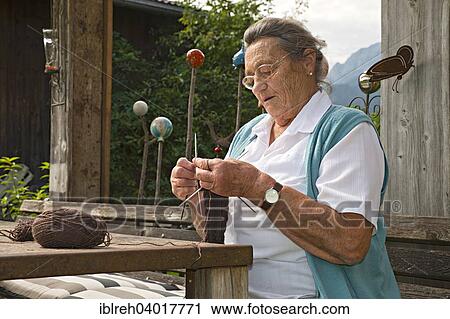 "Farmer working on the farm, knitting leg warmers, Kreutner family farm, Schwaz District, Tyrol, Austria Family" View Large Photo Image Stock Image - "Farmer working on the farm, knitting leg warmers, Kreutner family farm, Schwaz District, Tyrol, Austria Family". Fotosearch