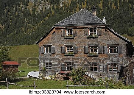 "Farmhouse, 200 years, with a shingle facade, now a holiday home, Hinterstein, Oberallgau, Bavaria, Germany, Europe" View Large Photo Image Picture - "Farmhouse, 200 years, with a shingle facade, now a holiday home, Hinterstein, Oberallgau, Bavaria, Germany, Europe". Fotosearch