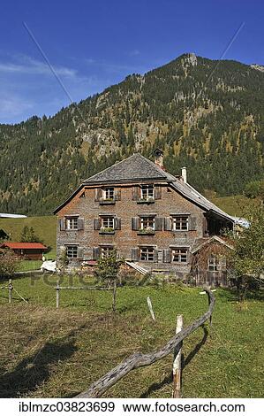 "Farmhouse, 200 years, with a shingle facade, now a holiday home, Hinterstein, Oberallgau, Bavaria, Germany, Europe" View Large Photo Image Stock Photo - "Farmhouse, 200 years, with a shingle facade, now a holiday home, Hinterstein, Oberallgau, Bavaria, Germany, Europe". Fotosearch