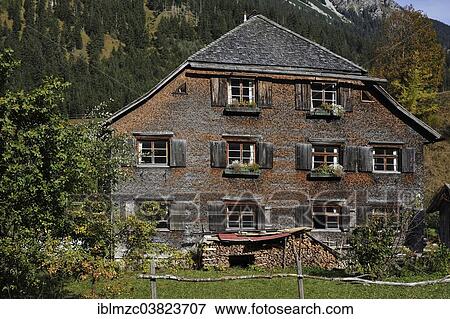 "Farmhouse, 200 years, with a shingle facade, now a holiday home, Hinterstein, Oberallgau, Bavaria, Germany, Europe" View Large Photo Image Stock Photo - "Farmhouse, 200 years, with a shingle facade, now a holiday home, Hinterstein, Oberallgau, Bavaria, Germany, Europe". Fotosearch