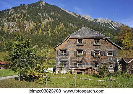"Farmhouse, 200 years, with a shingle facade, now a holiday home, Hinterstein, Oberallgau, Bavaria, Germany, Europe" View Large Photo Image Stock Photo - "Farmhouse, 200 years, with a shingle facade, now a holiday home, Hinterstein, Oberallgau, Bavaria, Germany, Europe". Fotosearch