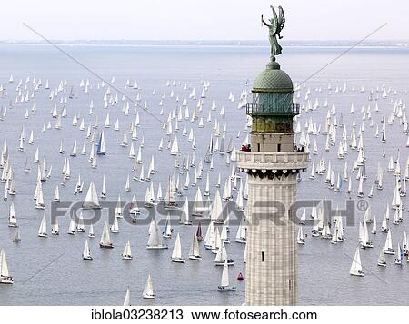 "Faro della Vittoria lighthouse, sailing boats taking part in the historic sailing regatta Barcolana at back, Trieste, Province of Trieste, Friuli-Venezia Giulia, Italy, Europe" View Large Photo Image Stock Image - "Faro della Vittoria lighthouse, sailing boats taking part in the historic sailing regatta Barcolana at back, Trieste, Province of Trieste, Friuli-Venezia Giulia, Italy, Europe". Fotosearch