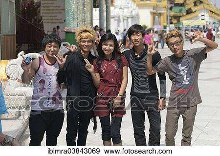 "Fashionable young Burmese people posing on the street, Yangon, Myanmar, Asia" View Large Photo Image Stock Photo - "Fashionable young Burmese people posing on the street, Yangon, Myanmar, Asia". Fotosearch