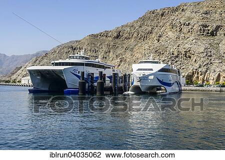 Stock Image - "Fast ferry from Khasab to Muscat, Khasab, Musandam, Oman, Asia". Fotosearch