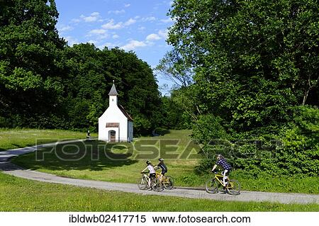 Father and children cycling, mountain biking, Chapel of St. Ulrich, Muehltal valley, Pupplinger Au, near Wolfratshausen, Upper Bavaria, Bavaria, Germany, Europe View Large Photo Image Stock Photography - Father and children cycling, mountain biking, Chapel of St. Ulrich, Muehltal valley, Pupplinger Au, near Wolfratshausen, Upper Bavaria, Bavaria, Germany, Europe. Fotosearch