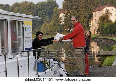 "Father and daughter with brought bread in the early morning, standing beside a houseboat on the Canal des Vosges, formerly Canal de l'Est, Selles, Vesoul, Region Franche-Comte, Dep. Haute-Saone, France, Europe" View Large Photo Image Stock Image - "Father and daughter with brought bread in the early morning, standing beside a houseboat on the Canal des Vosges, formerly Canal de l'Est, Selles, Vesoul, Region Franche-Comte, Dep. Haute-Saone, France, Europe". Fotosearch