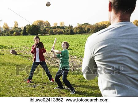 Father playing baseball with his sons View Large Photo Image Stock Image - Father playing baseball with his sons. Fotosearch