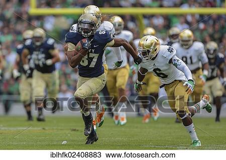 "FB Chris Swain, #37 Navy, runs with the ball during the NCAA football game between the Navy and the Notre Dame on September 1, 2012 in Dublin, Ireland, Europe" View Large Photo Image Stock Image - "FB Chris Swain, #37 Navy, runs with the ball during the NCAA football game between the Navy and the Notre Dame on September 1, 2012 in Dublin, Ireland, Europe". Fotosearch