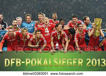 "FC Bayern celebrating their triple victory, team photo with the trophy, DFB Cup final 2013, FC Bayern Munich vs VfB Stuttgart in Berlin's Olympic Stadium, Berlin, Berlin, Germany, Europe" View Large Photo Image Stock Image - "FC Bayern celebrating their triple victory, team photo with the trophy, DFB Cup final 2013, FC Bayern Munich vs VfB Stuttgart in Berlin's Olympic Stadium, Berlin, Berlin, Germany, Europe". Fotosearch
