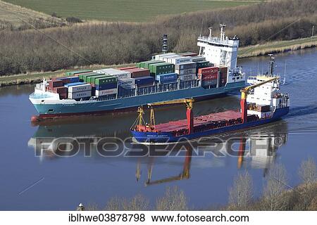 "Feeder and a specialised vessel on the Kiel Canal or Nord-Ostsee-Kanal, Brunsbuttel, Schleswig-Holstein, Germany, Europe" View Large Photo Image Stock Photo - "Feeder and a specialised vessel on the Kiel Canal or Nord-Ostsee-Kanal, Brunsbuttel, Schleswig-Holstein, Germany, Europe". Fotosearch