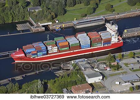 "Feeder ship """"Frederik"""" passing the Kiel-Holtenau canal locks, large lock, Kiel Canal, Nord-Ostsee-Kanal, aerial view, Kiel, Schleswig-Holstein, Germany, Europe" View Large Photo Image Stock Photo - "Feeder ship """"Frederik"""" passing the Kiel-Holtenau canal locks, large lock, Kiel Canal, Nord-Ostsee-Kanal, aerial view, Kiel, Schleswig-Holstein, Germany, Europe". Fotosearch