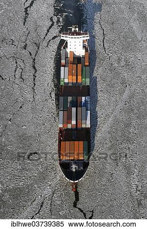 "Feeder vessel Tetuan surrounded by ice, aerial view, Hamburg, Hamburg, Germany, Europe" View Large Photo Image Stock Photography - "Feeder vessel Tetuan surrounded by ice, aerial view, Hamburg, Hamburg, Germany, Europe". Fotosearch