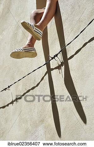 "Feet hanging out of a window, Saint-Gilles, Provence, France, Europe" View Large Photo Image Stock Photo - "Feet hanging out of a window, Saint-Gilles, Provence, France, Europe". Fotosearch