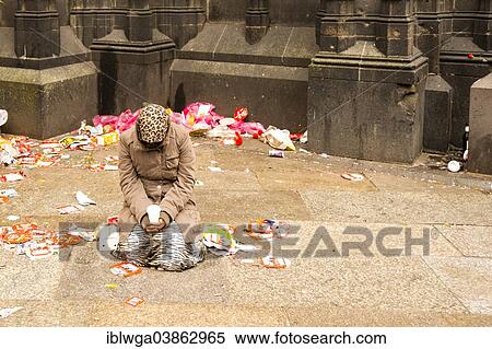 Stock Photography - "Female beggar on Domplatte square, begging on Carnival Monday, Cologne, North Rhine-Westphalia, Germany, Europe". Fotosearch