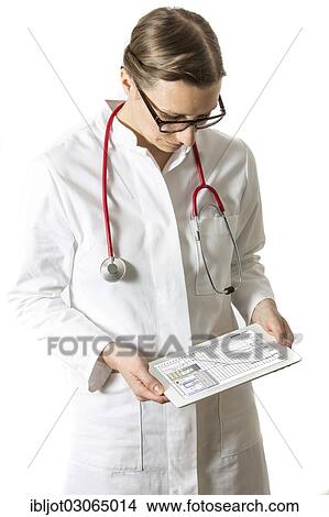 "Female doctor holding a tablet computer, iPad, with medical data, test results" View Large Photo Image Picture - "Female doctor holding a tablet computer, iPad, with medical data, test results". Fotosearch