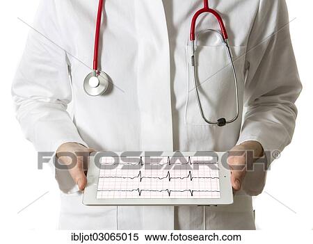 Stock Photography - "Female doctor holding a tablet computer, iPad, with an ECG graph". Fotosearch