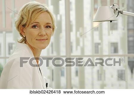 Female doctor in a white coat View Large Photo Image Stock Photo - Female doctor in a white coat. Fotosearch