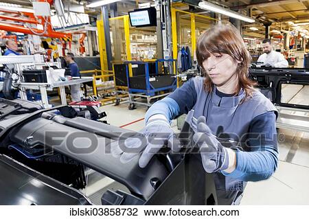"Female employee during the assembly of a leadframe, at MAN Truck and Bus AG, Munich, Upper Bavaria, Bavaria, Germany, Europe" View Large Photo Image Stock Image - "Female employee during the assembly of a leadframe, at MAN Truck and Bus AG, Munich, Upper Bavaria, Bavaria, Germany, Europe". Fotosearch