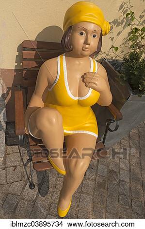 "Female figure from the 1950s sitting on a garden chair in front of an ice cream shop, Lauf an der Pegnitz, Middle Franconia, Bavaria, Germany, Europe" View Large Photo Image Picture - "Female figure from the 1950s sitting on a garden chair in front of an ice cream shop, Lauf an der Pegnitz, Middle Franconia, Bavaria, Germany, Europe". Fotosearch
