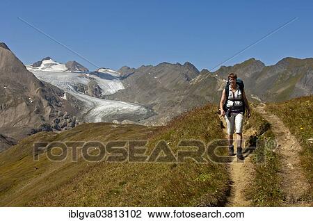 "Female hiker on a trail, Mt Blinnenhorn or Corno Cieco with the Gries Glacier at the back, Valais, Switzerland, Europe" View Large Photo Image Stock Image - "Female hiker on a trail, Mt Blinnenhorn or Corno Cieco with the Gries Glacier at the back, Valais, Switzerland, Europe". Fotosearch