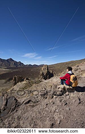 Stock Image - "Female hiker, Parque Nacional del Teide, Tenerife, Canary Islands, Spain, Europe". Fotosearch