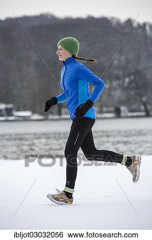 "Female jogger on a run in winter at Lake Baldeney, Baldeneysee, bei Essen, Germany, Europe" View Large Photo Image Stock Photograph - "Female jogger on a run in winter at Lake Baldeney, Baldeneysee, bei Essen, Germany, Europe". Fotosearch
