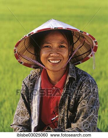 "Female worker in a rice paddy, Laos, Asia" View Large Photo Image Stock Image - "Female worker in a rice paddy, Laos, Asia". Fotosearch