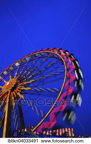 "Ferris wheel at dusk, blue hour, Hamburger Dom funfair, Hamburg, Germany, Europe" View Large Photo Image Stock Image - "Ferris wheel at dusk, blue hour, Hamburger Dom funfair, Hamburg, Germany, Europe". Fotosearch