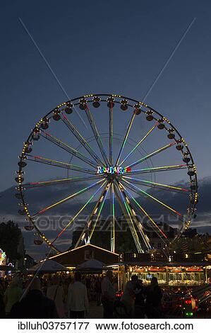 Stock Photo - "Ferris wheel at dusk, Laurentiuskirmes fun fair, Bergisch Gladbach, North Rhine-Westphalia, Germany, Europe". Fotosearch