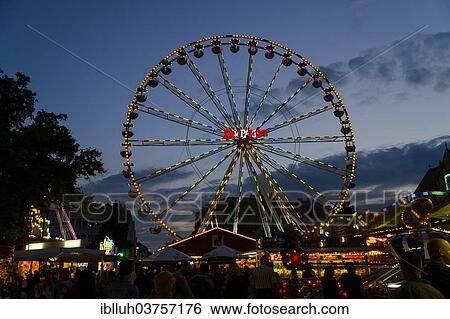 "Ferris wheel at dusk, Laurentiuskirmes fun fair, Bergisch Gladbach, North Rhine-Westphalia, Germany, Europe" View Large Photo Image Stock Photograph - "Ferris wheel at dusk, Laurentiuskirmes fun fair, Bergisch Gladbach, North Rhine-Westphalia, Germany, Europe". Fotosearch