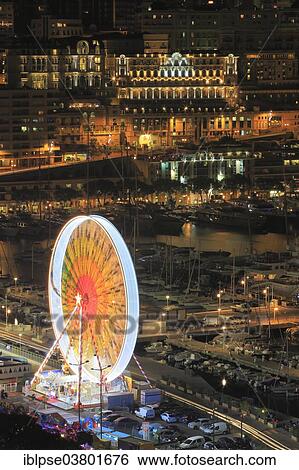 "Ferris wheel at Port Hercule, behind Hotel Hermitage Monte-Carlo, Monaco, Mediterranean, Europe" View Large Photo Image Stock Photograph - "Ferris wheel at Port Hercule, behind Hotel Hermitage Monte-Carlo, Monaco, Mediterranean, Europe". Fotosearch