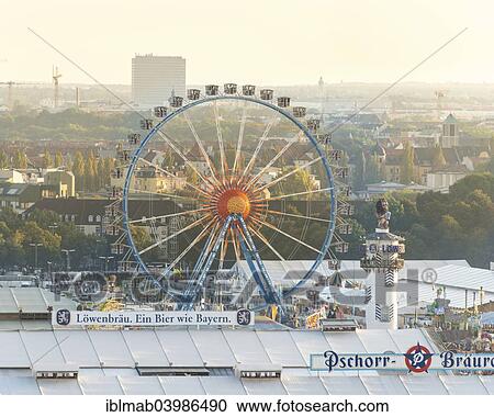 "Ferris wheel with Lowenbrau tower, in front beer tents, Oktoberfest, Oktoberfest, Theresienwiese, Munich, Upper Bavaria, Bavaria, Germany, Europe" View Large Photo Image Stock Image - "Ferris wheel with Lowenbrau tower, in front beer tents, Oktoberfest, Oktoberfest, Theresienwiese, Munich, Upper Bavaria, Bavaria, Germany, Europe". Fotosearch