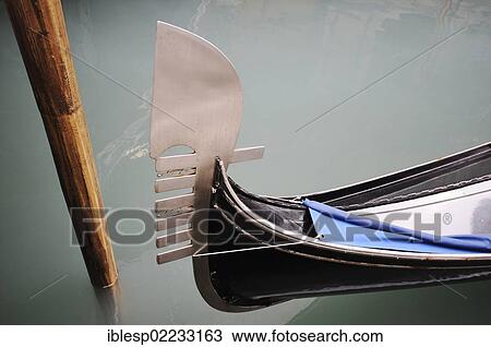 Stock Image - "Ferro with metal teeth, metal design on the bow of a gondola, Venice, Venezia, Veneto, Italy, Europe". Fotosearch