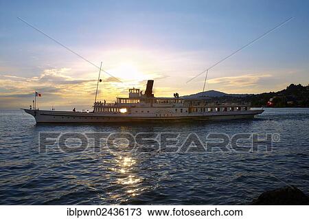 "Ferry at sunset on Lac Leman, Lake Geneva, Montreux, Switzerland, Europe" View Large Photo Image Stock Image - "Ferry at sunset on Lac Leman, Lake Geneva, Montreux, Switzerland, Europe". Fotosearch