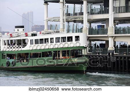 Stock Photo - "Ferry at the Star Ferry pier at the harbor, Victoria Harbour, Chung Wan, Central District, Hong Kong Island, Hong Kong, China, Asia". Fotosearch