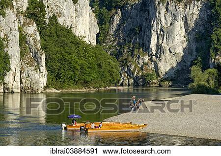 Stock Image - "Ferry boats for crossing the Danube River at the Danube Gorge, Kelheim, Lower Bavaria, Bavaria, Germany, Europe". Fotosearch