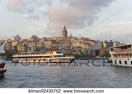 Stock Image - "Ferry, Golden Horn with the districts of Karakoy and Beyoglu, Galata Tower, Istanbul, european side, Turkey, Europe, Asia". Fotosearch