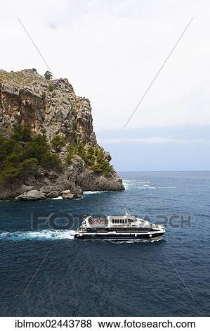 "Ferry in the Bay of Sa Calobra, Tramuntana Mountains, Majorca, Balearic Islands, Mediterranean Sea, Spain, Europe" View Large Photo Image Stock Photo - "Ferry in the Bay of Sa Calobra, Tramuntana Mountains, Majorca, Balearic Islands, Mediterranean Sea, Spain, Europe". Fotosearch