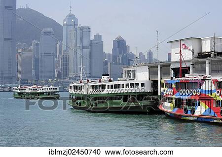 Stock Image - "Ferry in the Bay of Victoria Harbour and Hong Kong Island, Star Ferry Pier, Tsim Sha Tsui, Kowloon, Hong Kong, China, Asia". Fotosearch