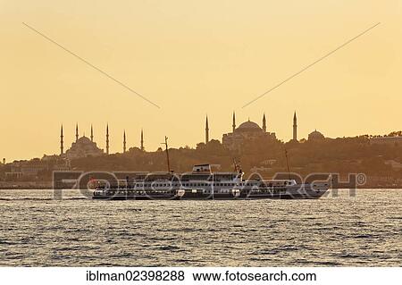 "Ferry on the Bosphorus, Blue Mosque and Hagia Sophia at back, view from Uskudar, Istanbul, Turkey, Europe, Asia" View Large Photo Image Stock Photo - "Ferry on the Bosphorus, Blue Mosque and Hagia Sophia at back, view from Uskudar, Istanbul, Turkey, Europe, Asia". Fotosearch