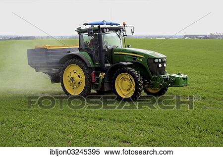 "Fertilisation with a tractor on a green field, Ystad, Scania, Sweden, Europe" View Large Photo Image Stock Photography - "Fertilisation with a tractor on a green field, Ystad, Scania, Sweden, Europe". Fotosearch