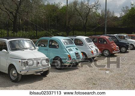 Stock Image - "Fiat 500, small cars parked in a row, Bolsena, Lazio, Italy, Southern Europe, Europe". Fotosearch
