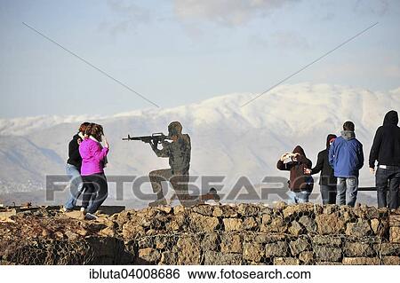 "Figure of a soldier and people on the Golan Heights with view of Mount Bental, Golan Heights, Israel, Asia" View Large Photo Image Stock Photograph - "Figure of a soldier and people on the Golan Heights with view of Mount Bental, Golan Heights, Israel, Asia". Fotosearch