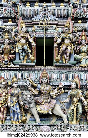 "Figures at the entrance of a Hindu temple, Veerama Kaliamman Temple, Serangoon Road, in the Indian district, Little India, city centre, Singapore, Asia" View Large Photo Image Stock Photo - "Figures at the entrance of a Hindu temple, Veerama Kaliamman Temple, Serangoon Road, in the Indian district, Little India, city centre, Singapore, Asia". Fotosearch